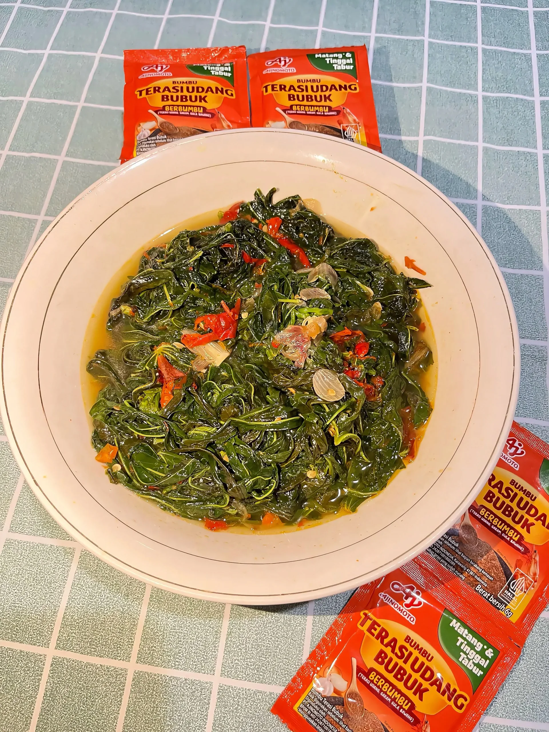 Tumis sayur daun Pepaya Ala Terasi bubuk Ajinomoto ®